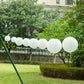 Set of 8 ivory hanging paper lanterns in assorted sizes, perfect for decoration.