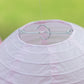 Set of 8 mixed blush gold hanging paper lanterns in assorted sizes.