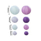Set of 8 purple and white hanging paper lanterns in assorted sizes.