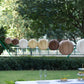 Natural brown hanging paper lanterns in assorted sizes.
