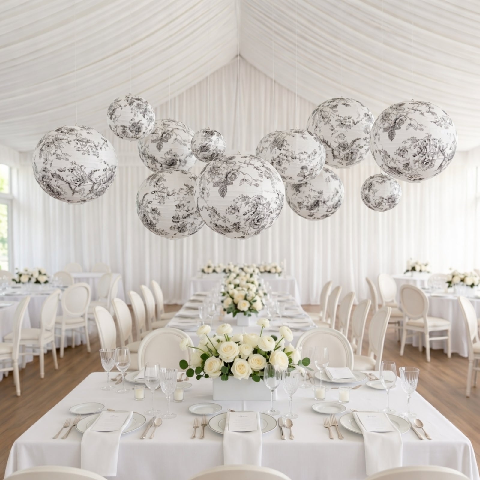 White paper lanterns with black floral pattern, decorative hanging lanterns.
