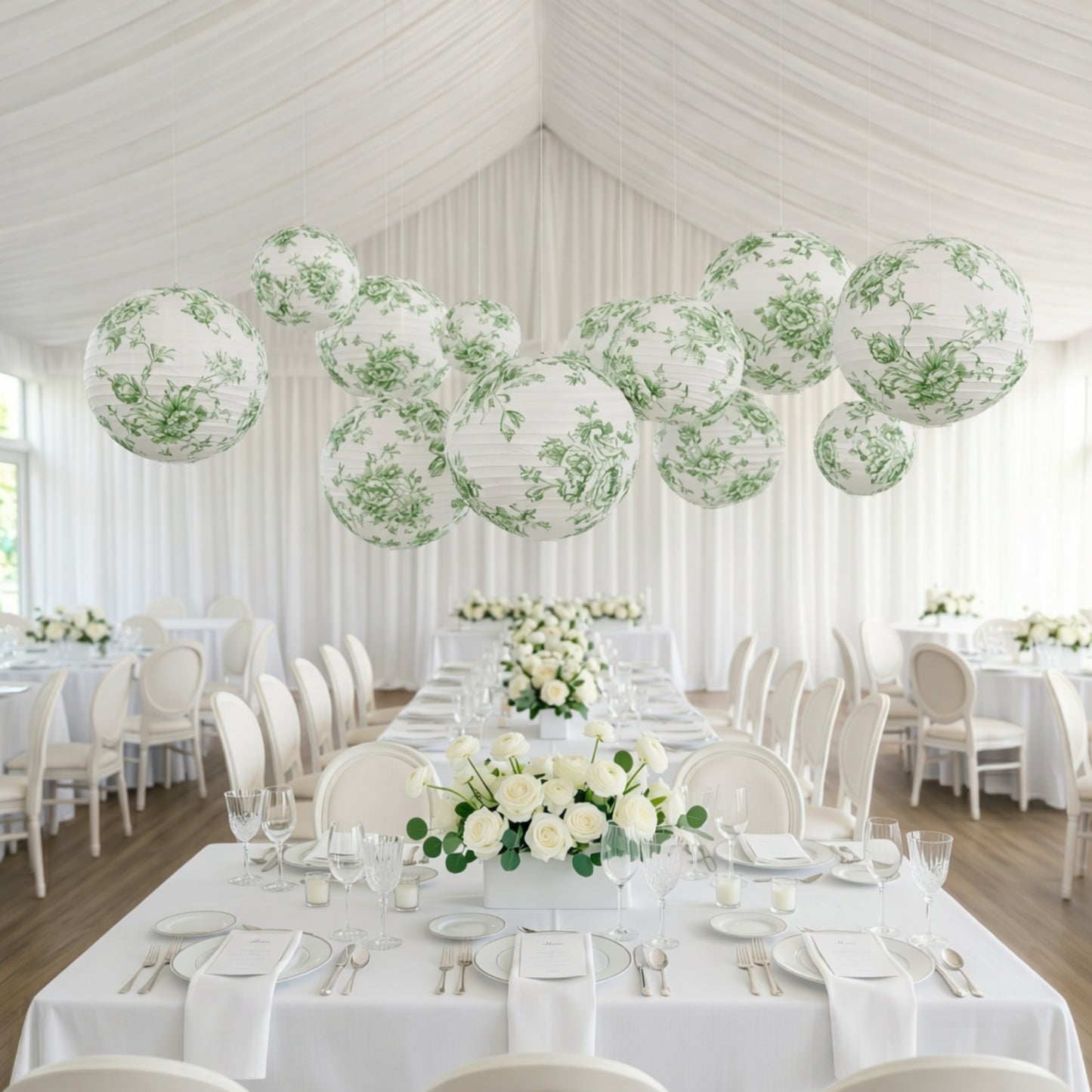 Set of 8 white paper lanterns with sage green floral patterns, perfect for decor.