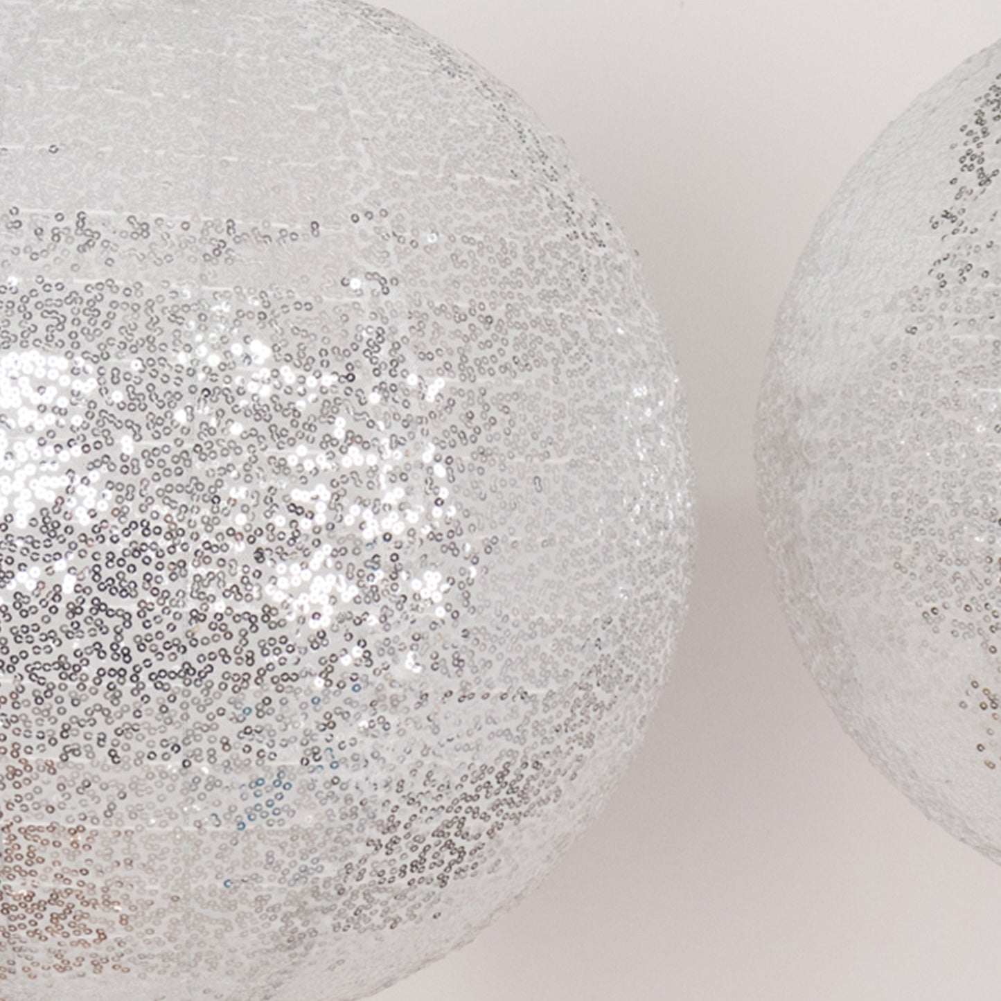 Glitter silver sequin fabric hanging lanterns in three sizes.