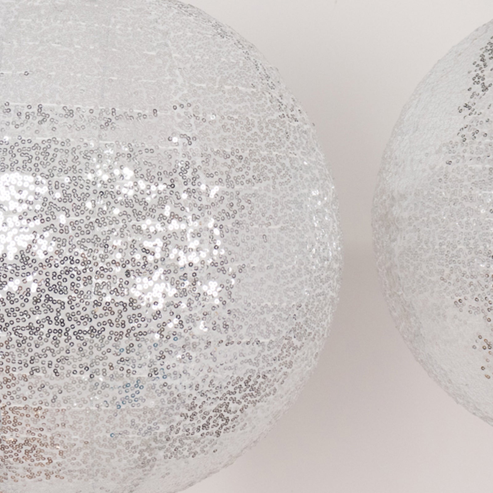 Glitter silver sequin fabric hanging lanterns in three sizes.