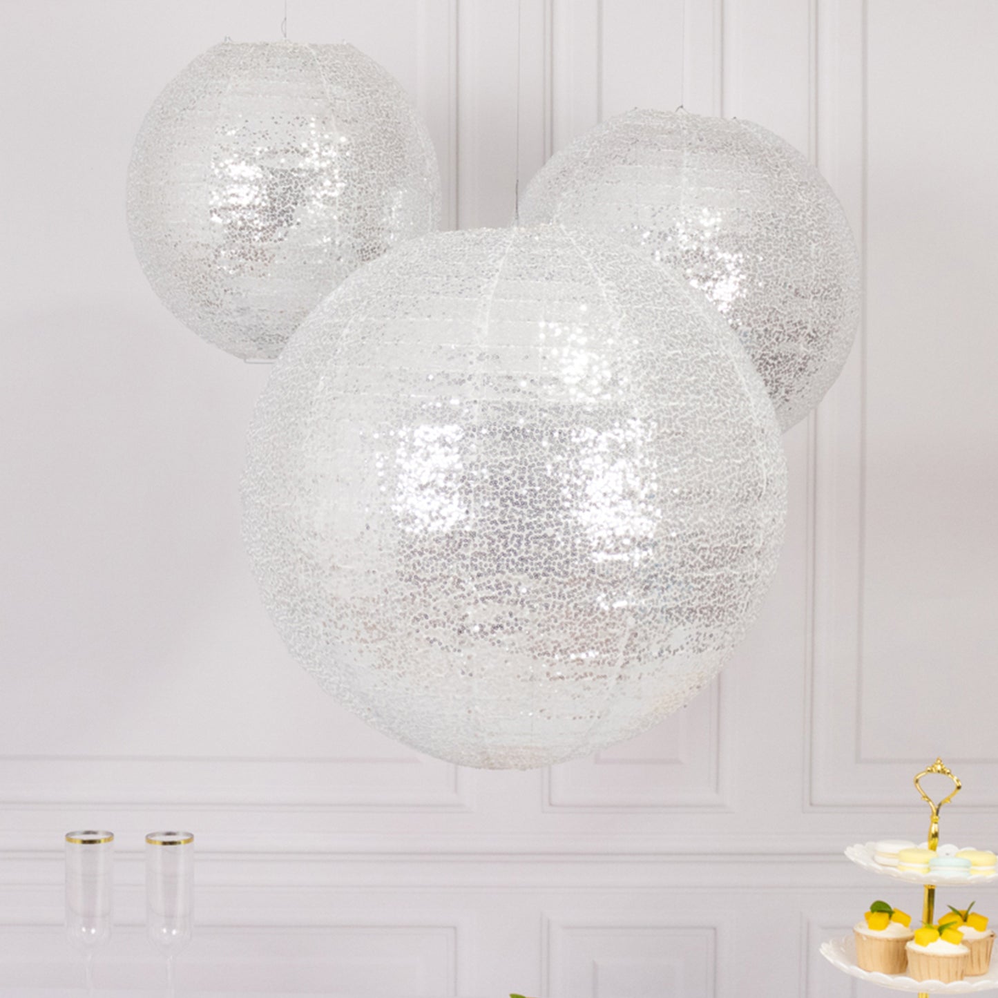 Glitter silver sequin fabric hanging lanterns in three sizes.