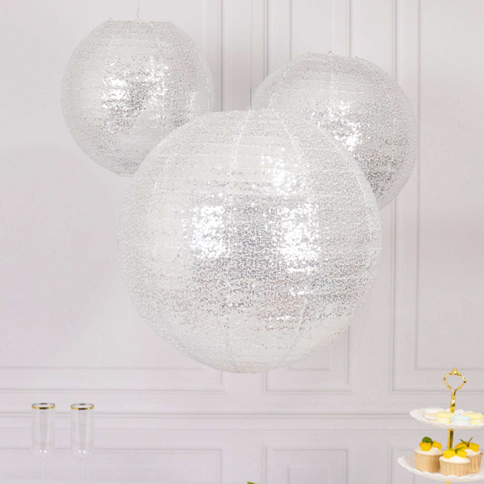 Glitter silver sequin fabric hanging lanterns in three sizes.