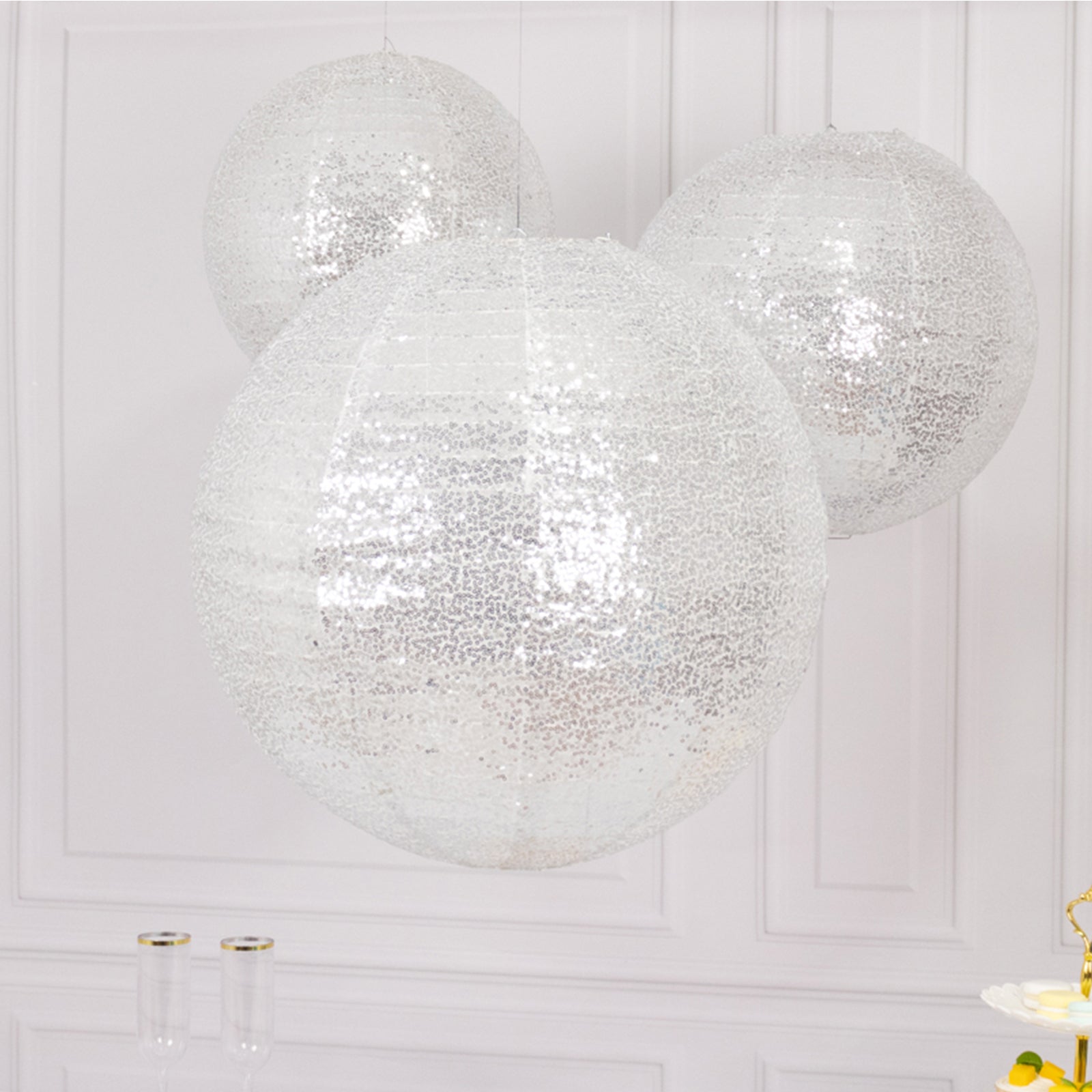 Glitter silver sequin fabric hanging lanterns in three sizes.