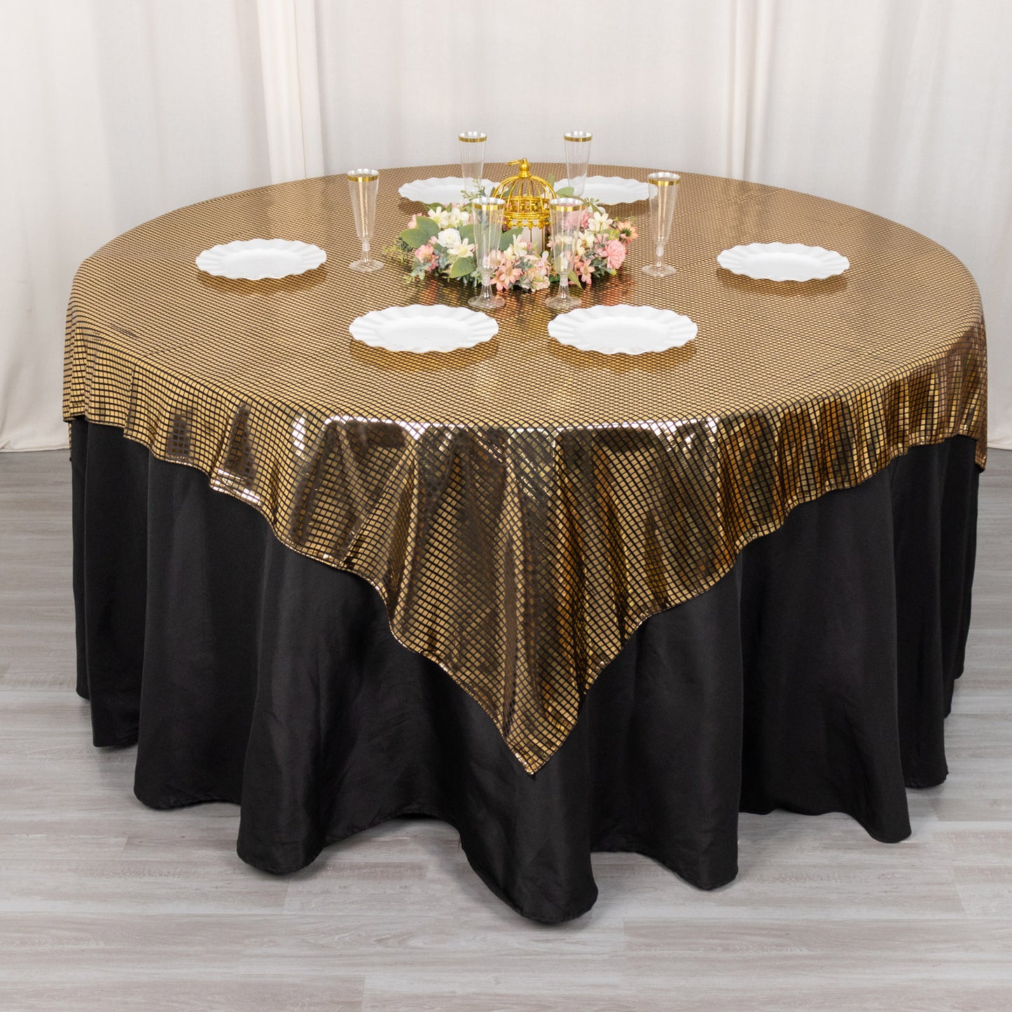 Shiny black gold foil table overlay for disco-themed decor.