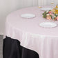 Iridescent pink glitter table overlay with a floral centerpiece.