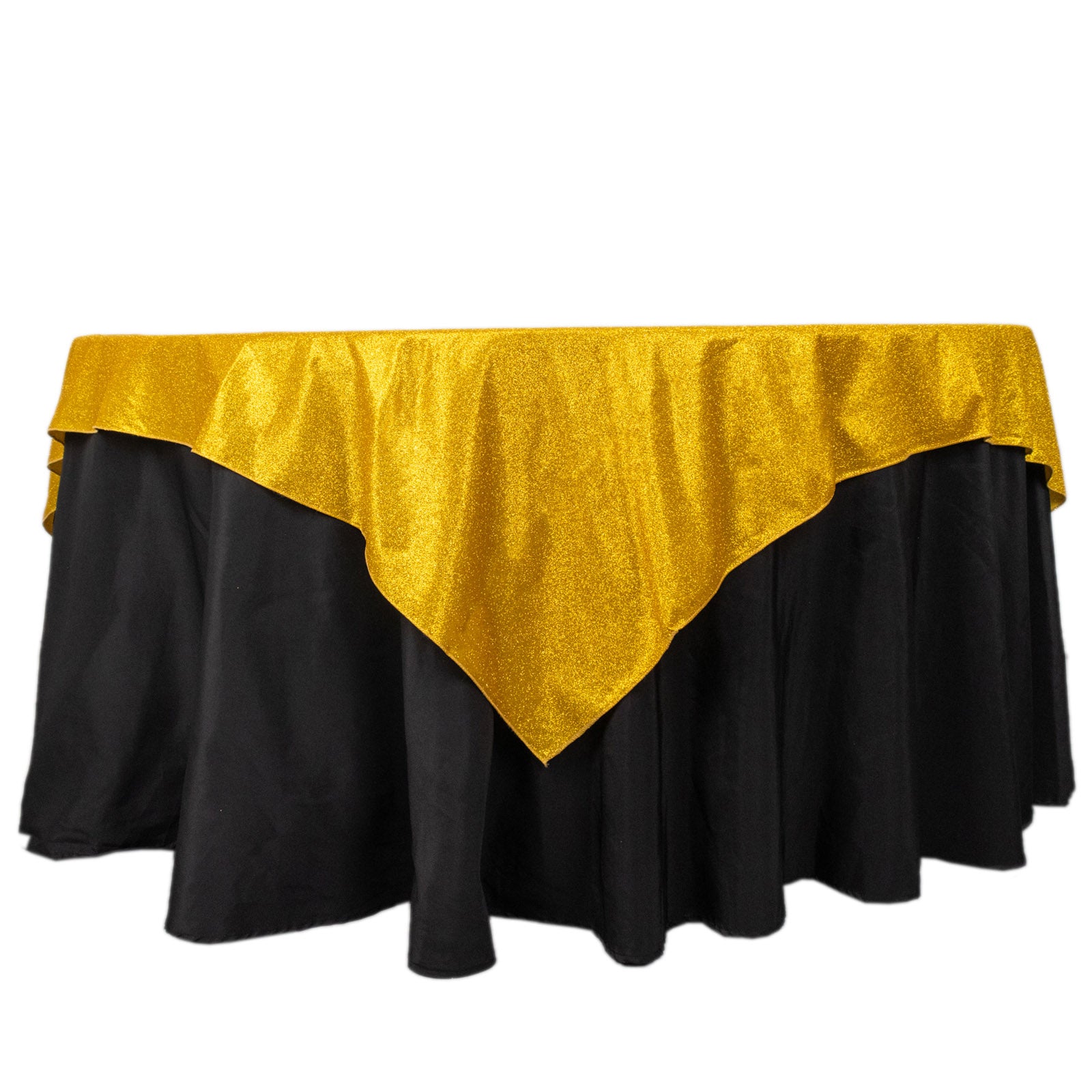 Gold glitter table overlay on a black tablecloth.