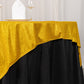 Gold glitter table overlay on a black tablecloth, perfect for elegant events.