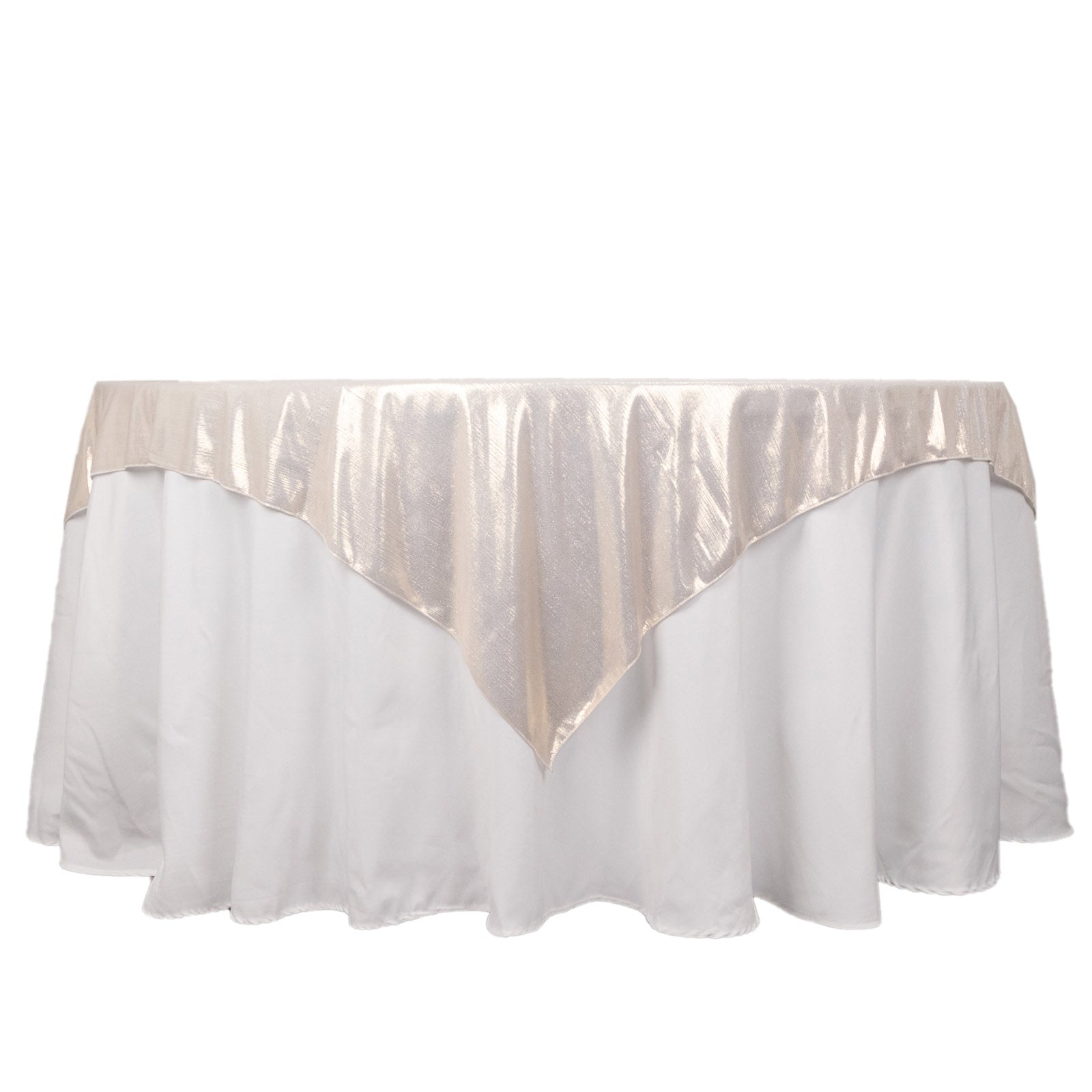 Beige shimmer sequin dots table overlay on a white tablecloth.