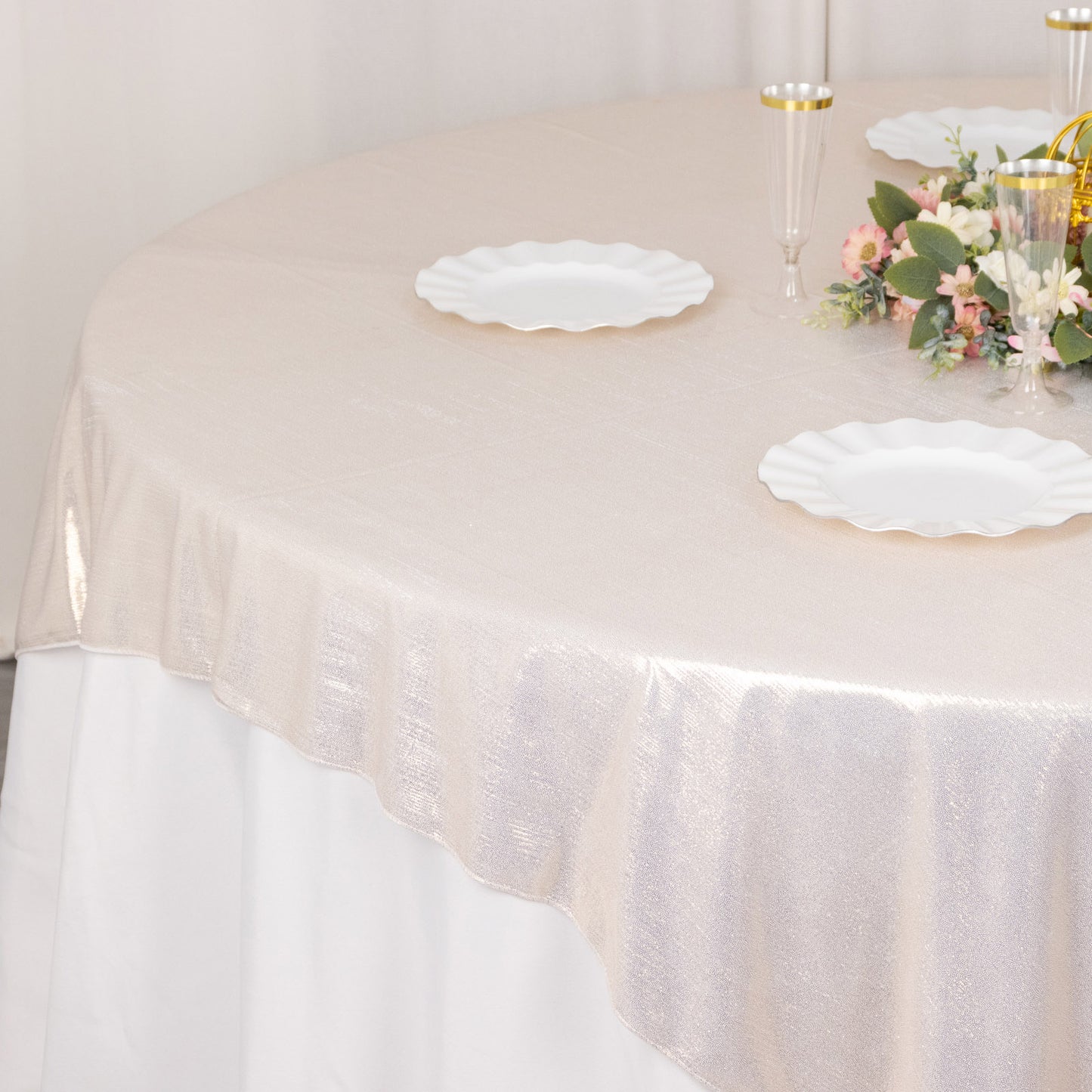 Beige shimmer sequin dots table overlay on a round table.