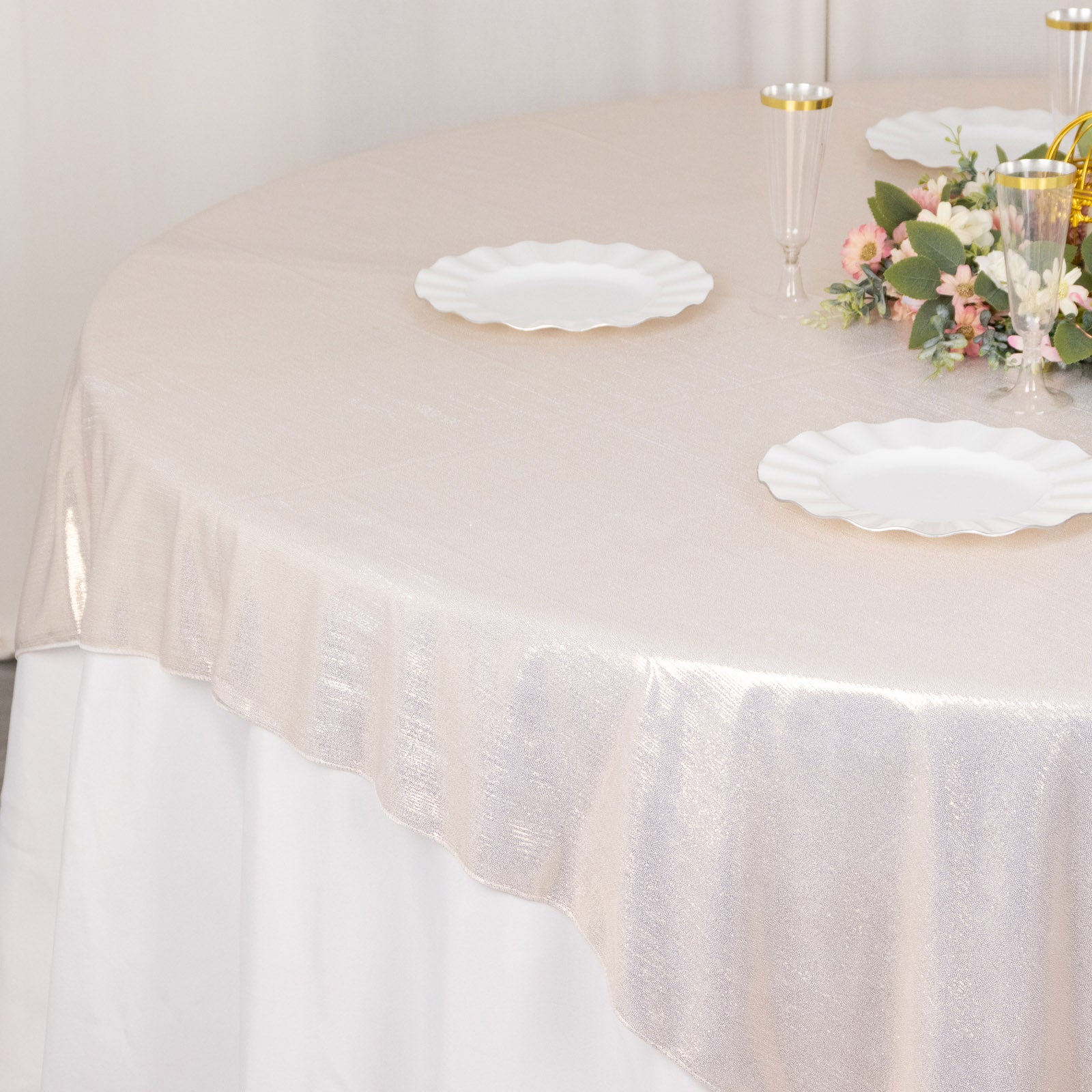 Beige shimmer sequin dots table overlay on a round table.
