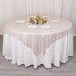Beige shimmer sequin dots square table overlay on a round table.
