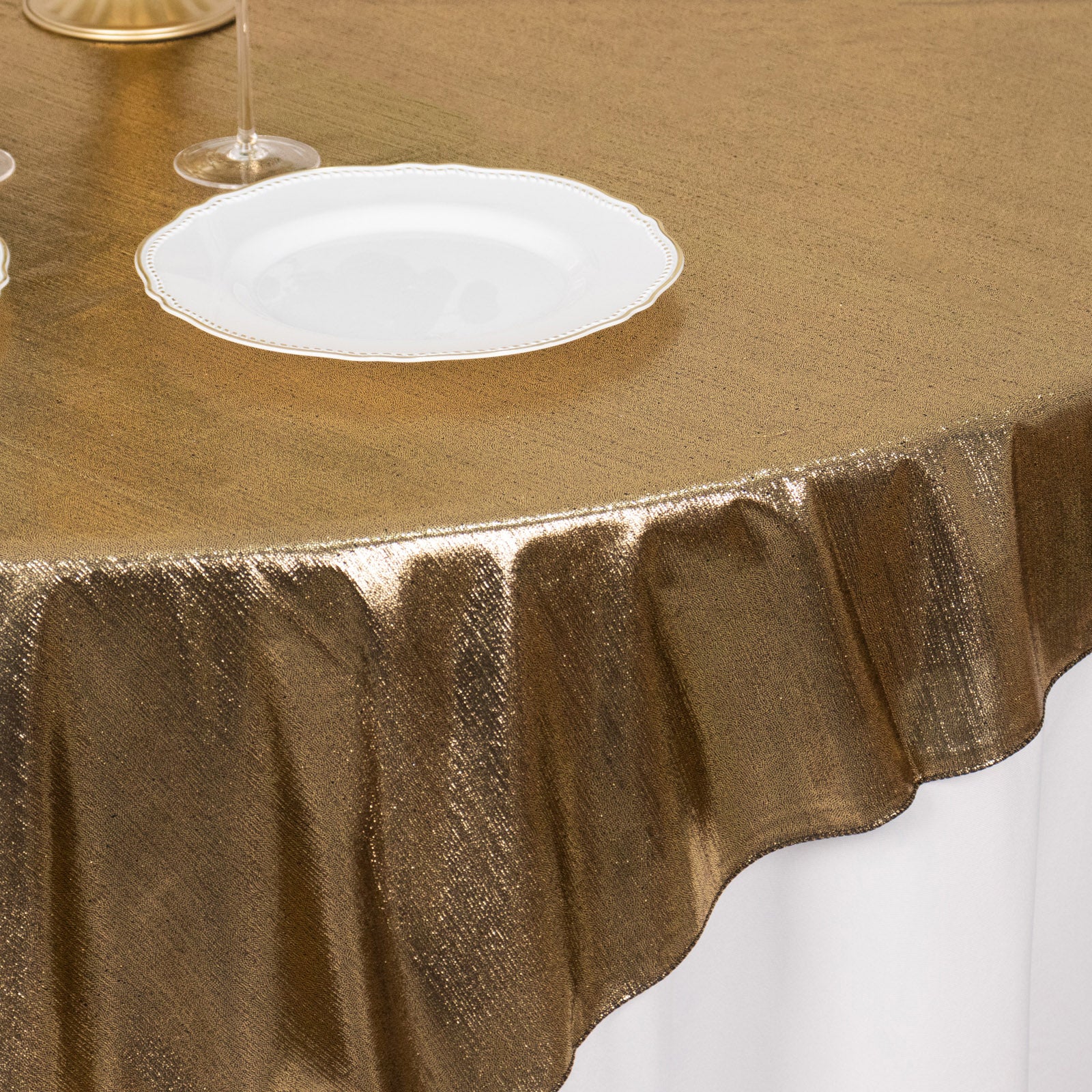 Antique gold shimmer sequin dots table overlay for elegant decor.