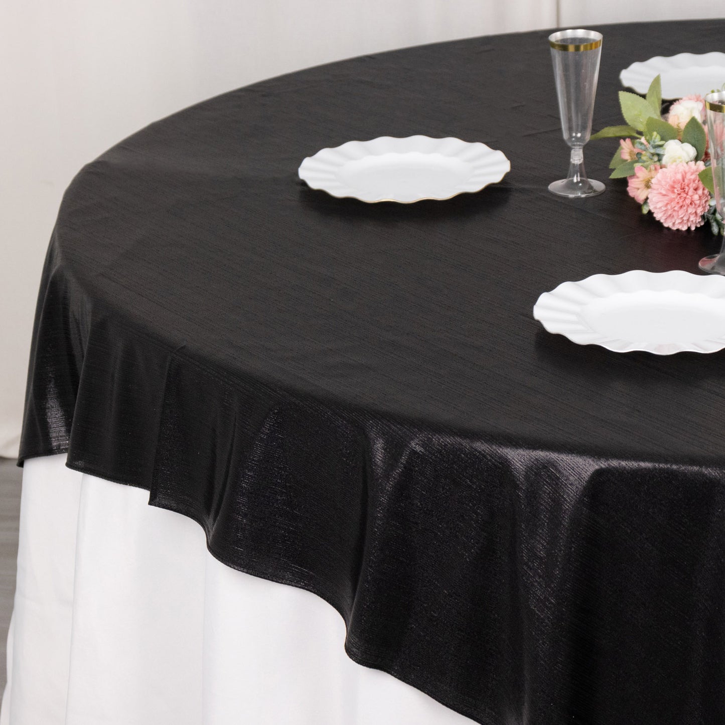 Black shimmer sequin dots table overlay for elegant decor.
