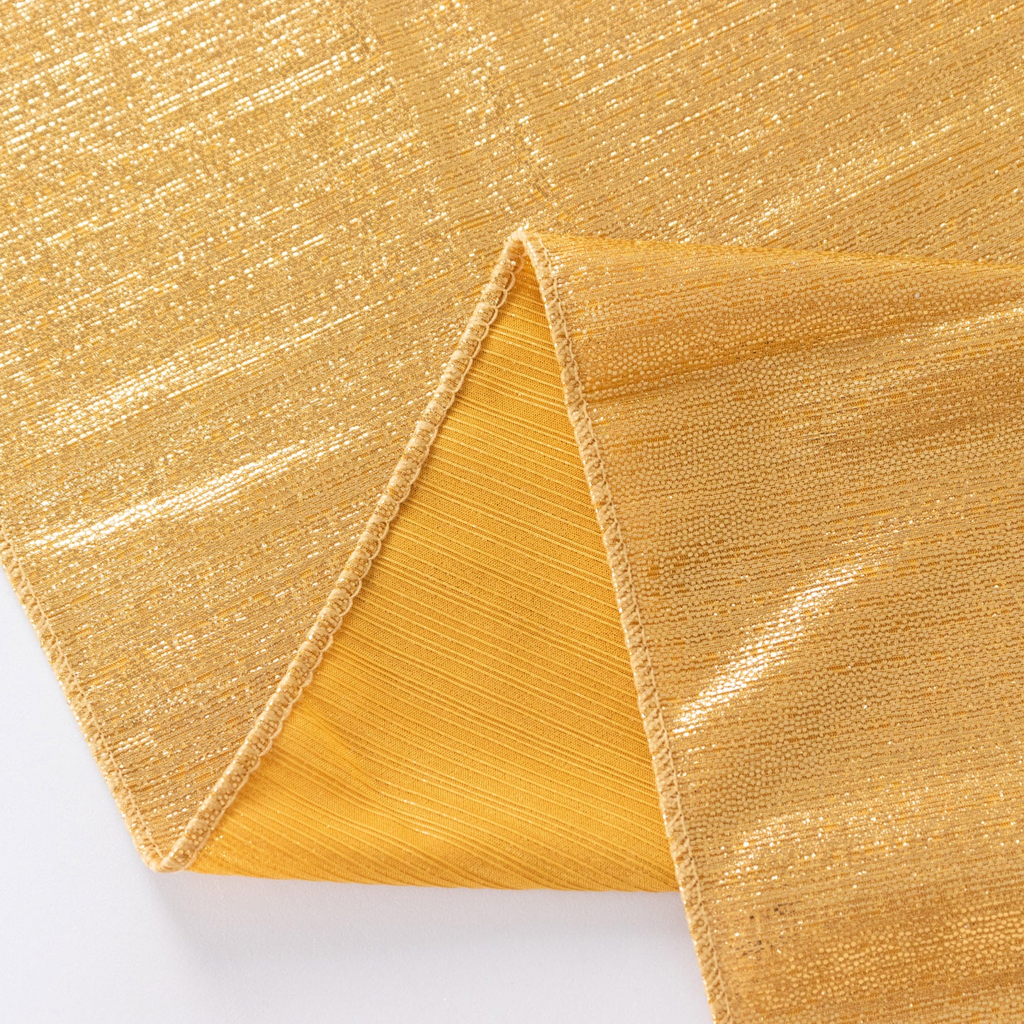 Gold sequin table overlay with a shimmer finish.