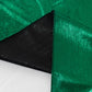 Hunter emerald green shimmer sequin table overlay with black edges.