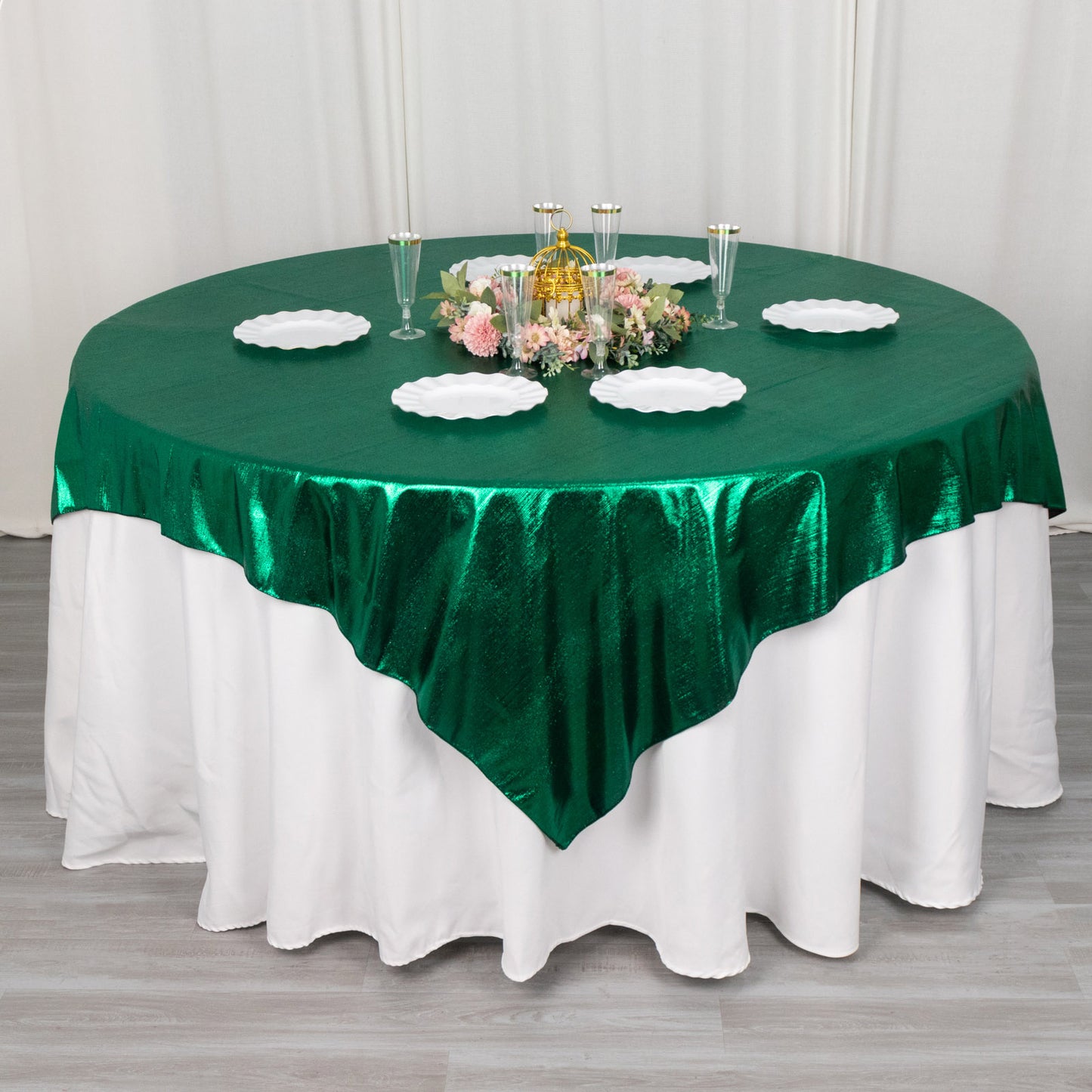 72"x72" Hunter Emerald Green Shimmer Sequin Dots Table Overlay on a round table.