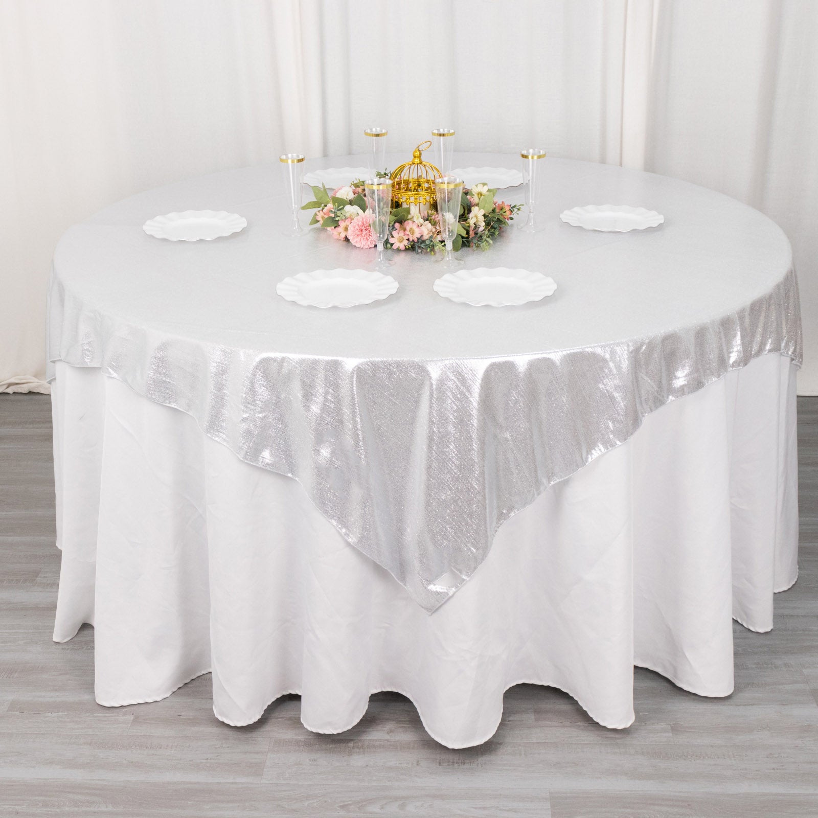 Silver shimmer sequin dots table overlay on a round table.