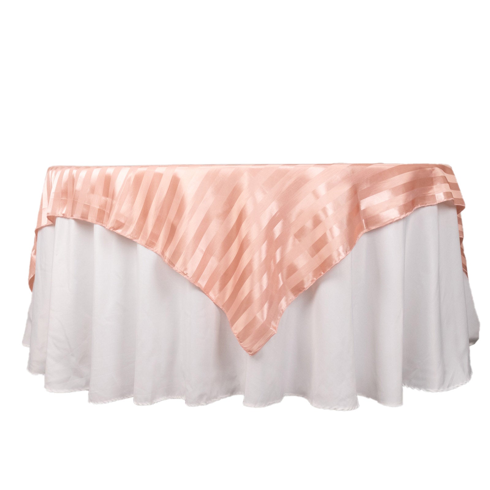 Dusty rose satin stripe table overlay on a white table.