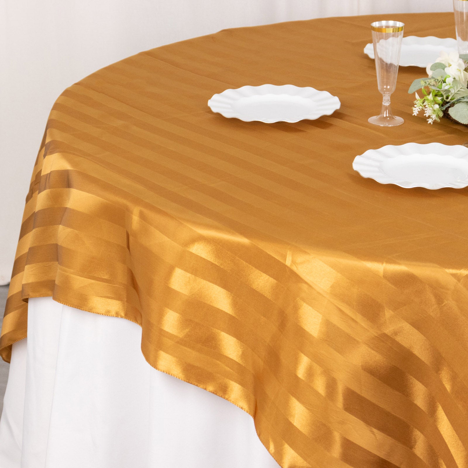 Gold satin stripe table overlay, smooth elegant table topper.