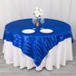 Royal blue satin stripe table overlay on a round table with elegant decor.