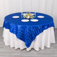 72"x72" royal blue satin stripe square table overlay on a round table.