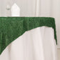 Green fringe shag square table overlay on a white tablecloth.