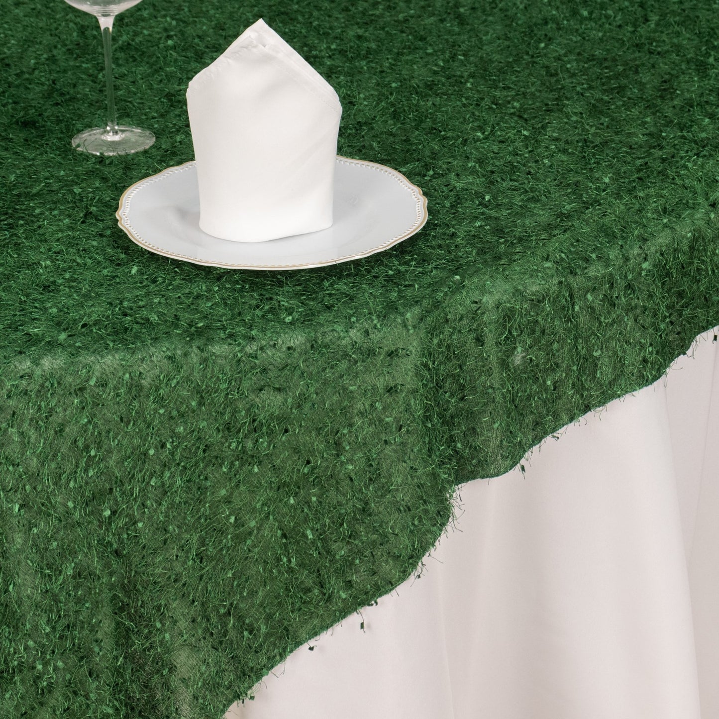 Green fringe shag square polyester table overlay.