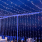 Blue 600 LED twinkle fairy lights in a curtain string display.
