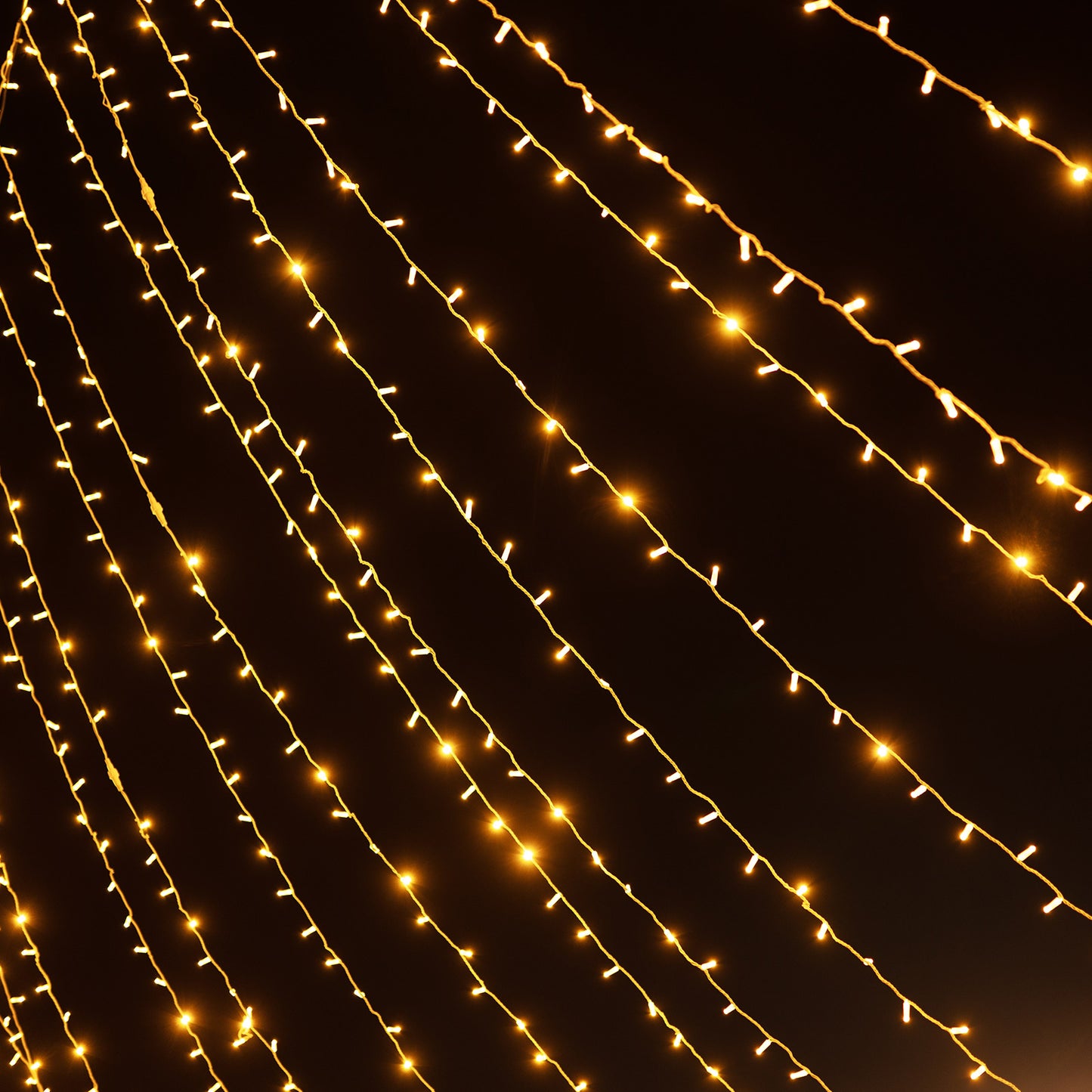 Warm white LED curtain string lights for indoor and outdoor decoration.