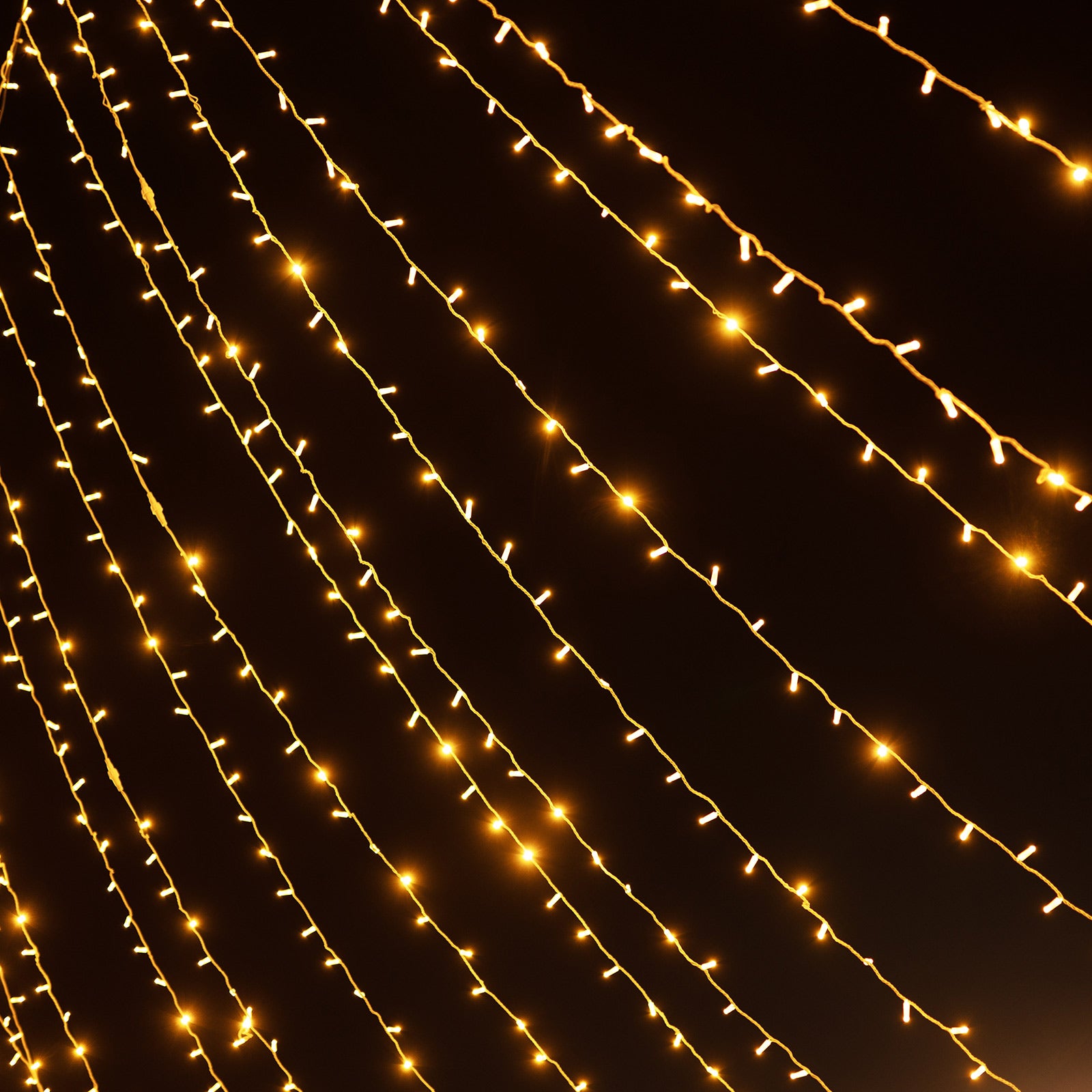 Warm white LED curtain string lights for indoor and outdoor decoration.