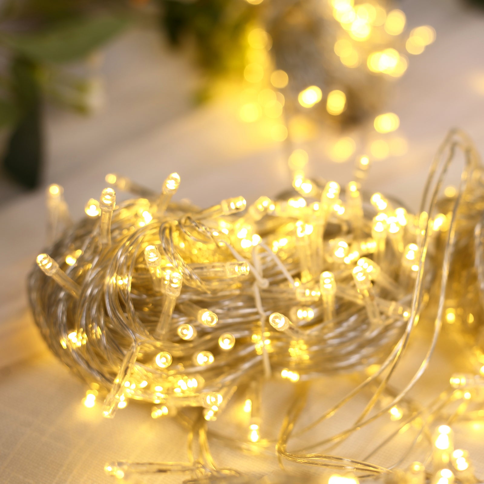 Warm white LED curtain fairy lights on a blurred background.