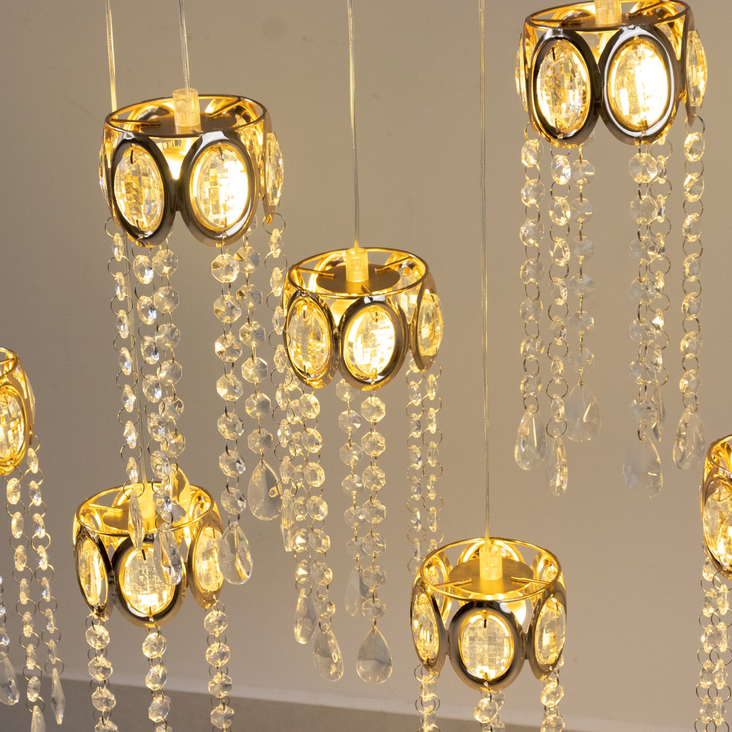 Gold oval frame LED crystal string lights with teardrop pendants.