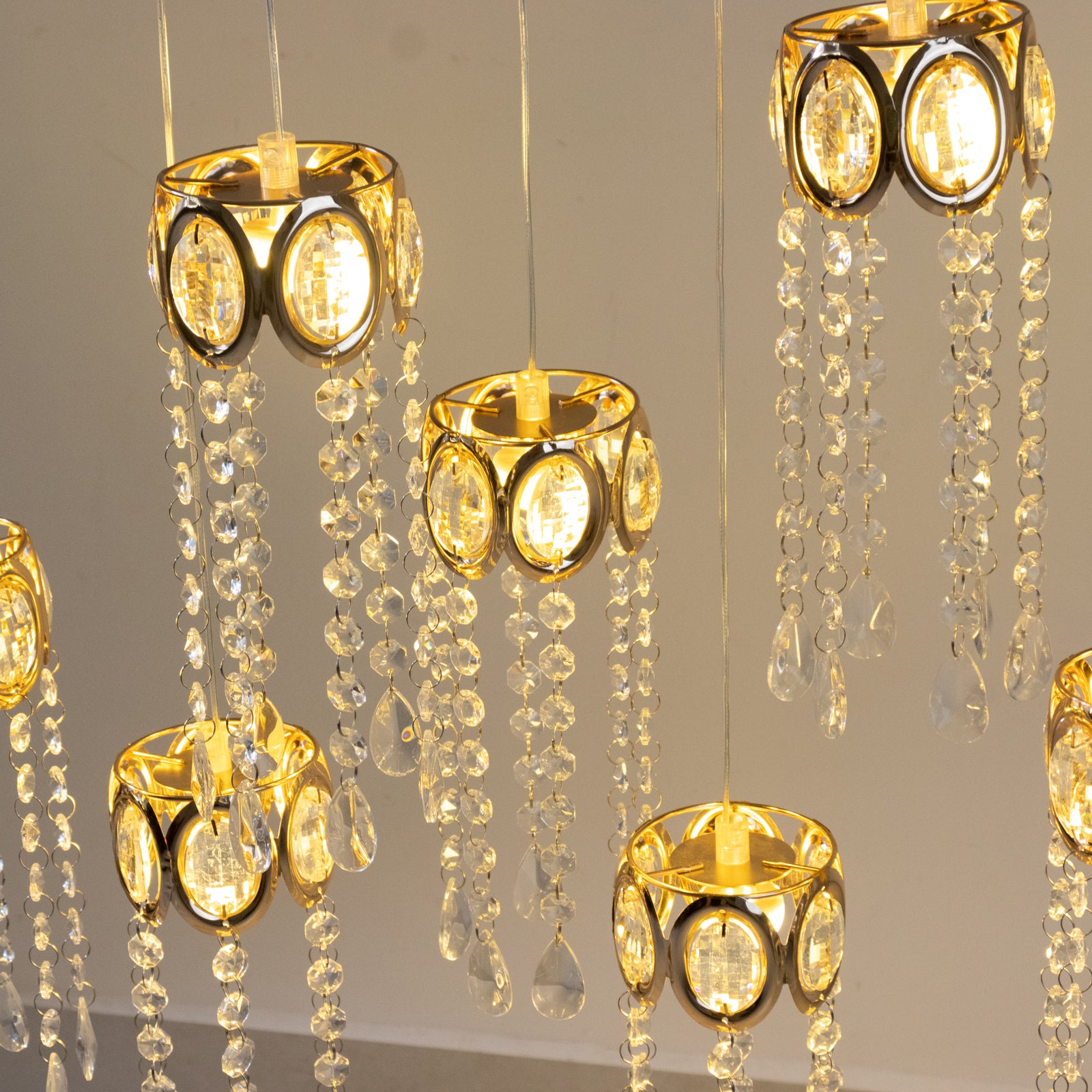Gold oval frame LED crystal string lights with teardrop pendants.