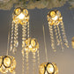 Gold crystal string lights with teardrop pendants and warm white glow.