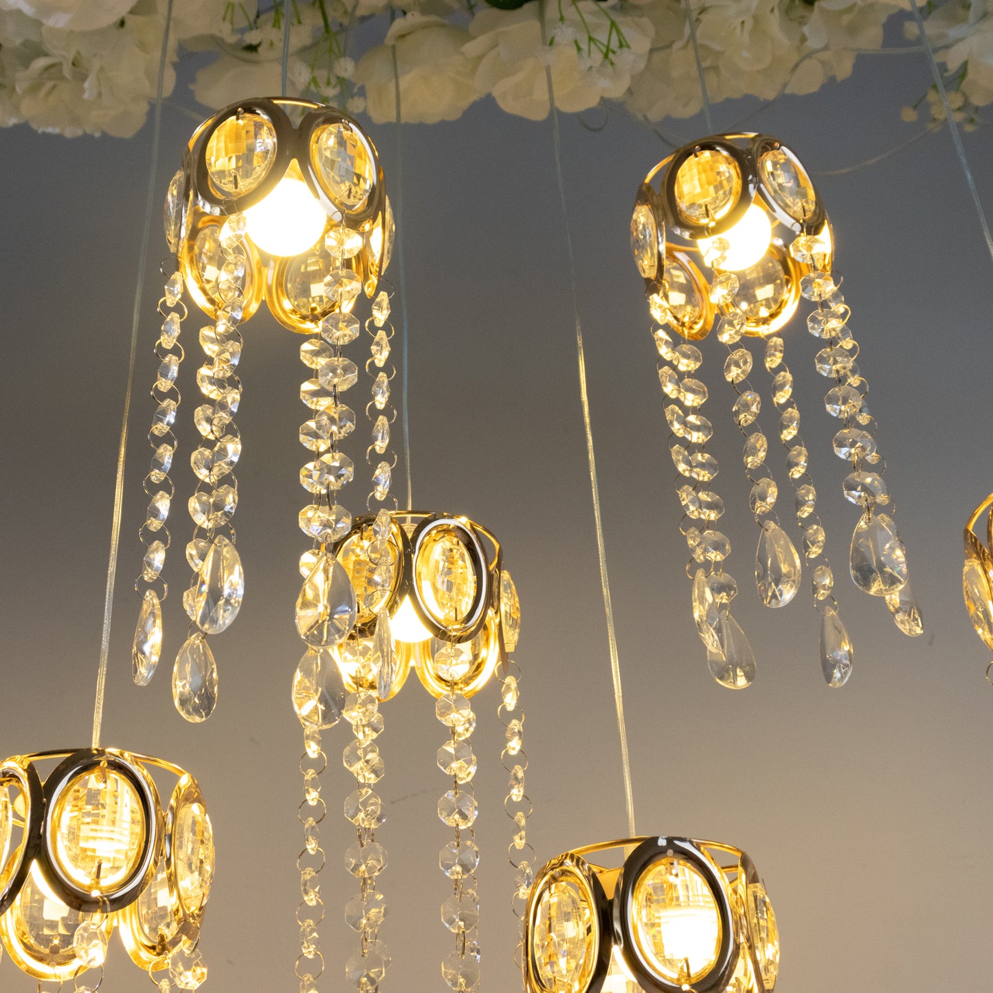 Gold crystal string lights with teardrop pendants and warm white glow.
