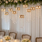 Gold oval frame chandelier with teardrop pendants and warm white lights.
