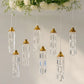 Gold bell frame with warm white crystal pendants hanging decor.