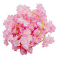 Pink cherry blossom fairy lights on a battery-operated string.