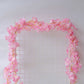 Pink cherry blossom fairy string lights with warm white LEDs.