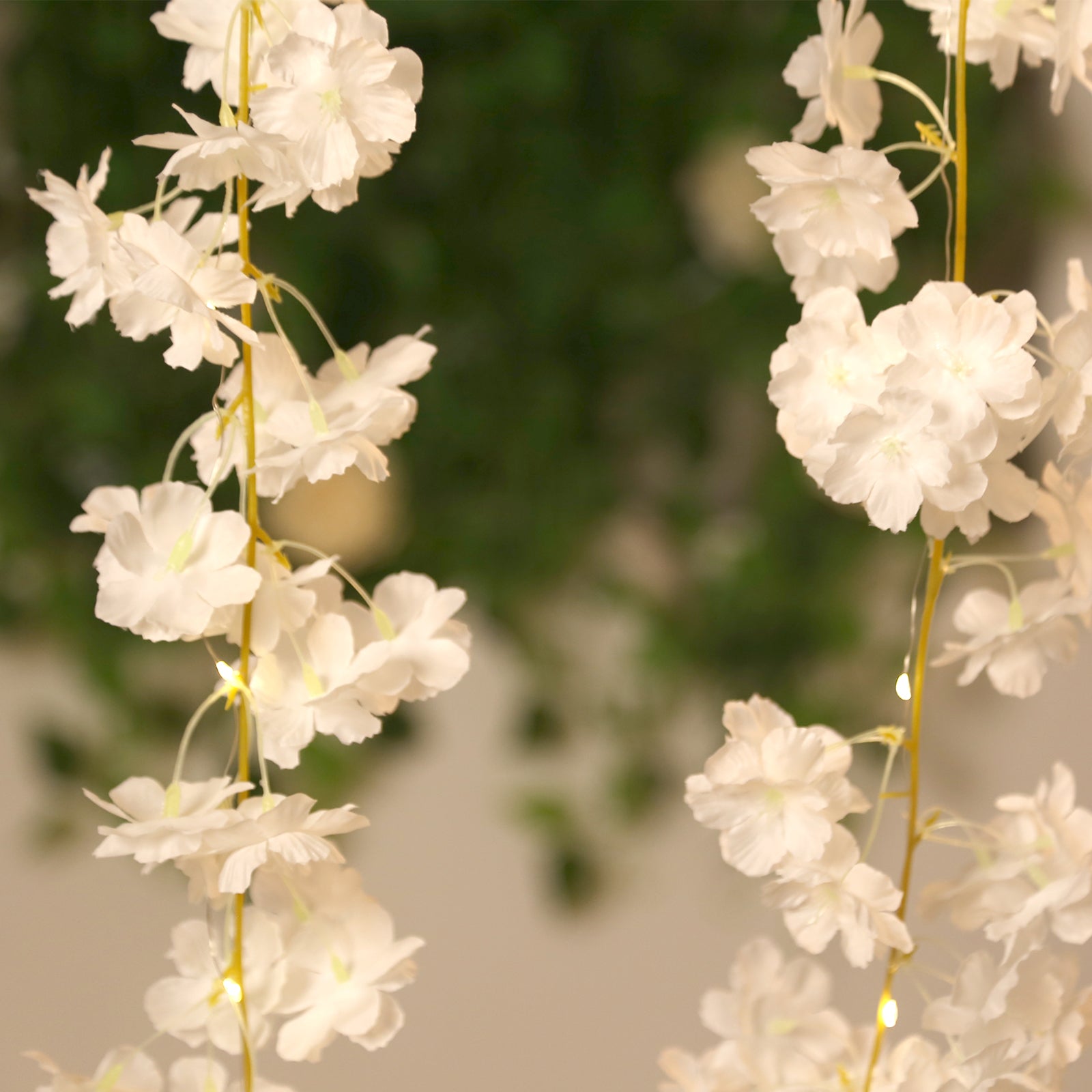 White artificial cherry blossom garland with warm white LED lights.