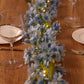 Blue jasmine silk flower garland with warm white fairy lights.