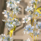 Blue jasmine silk flower garland with warm white LED fairy lights.