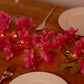 Pink jasmine silk flower garland with warm white LED fairy lights.