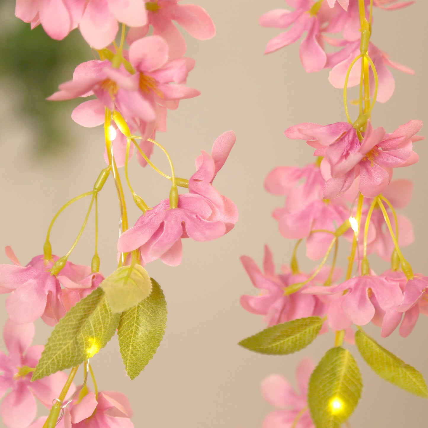Pink jasmine flower garland with warm white LED lights, 6ft long.