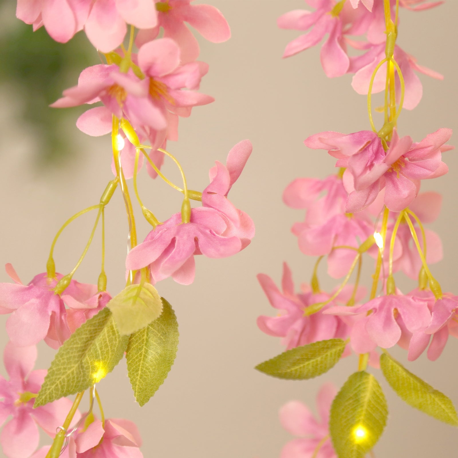 Pink jasmine flower garland with warm white LED lights, 6ft long.