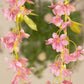 Pink jasmine flower garland with warm white LED lights, 6ft long.